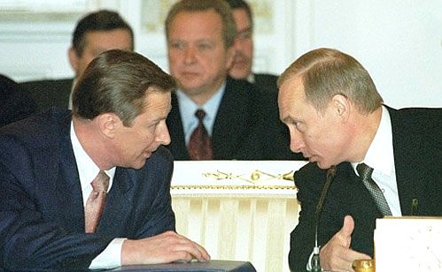 President Putin with Defence Minister Sergei Ivanov at a meeting of the CIS Heads of State Council.