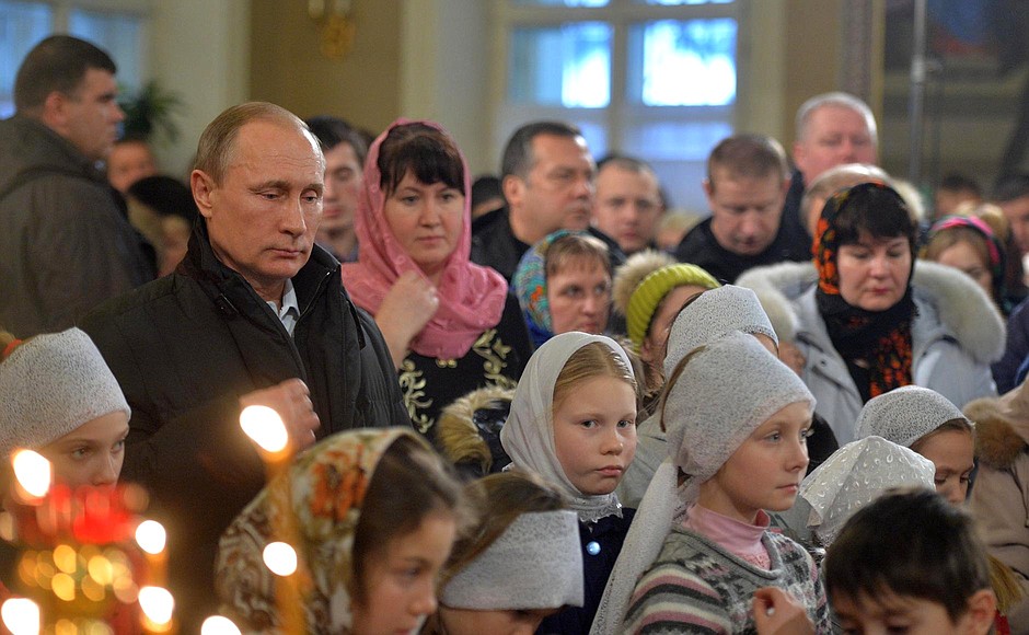 Vladimir Putin attends Christmas mass at the Church of the Intercession of the Holy Virgin in the village of Turginovo in Tver Region.