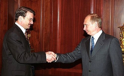 President Putin with Economic Development and Trade Minister German Gref.