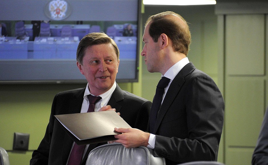 Chief of Staff of the Presidential Executive Office Sergei Ivanov with Industry and Trade Minister Denis Manturov before the beginning of the unified military goods commissioning day.