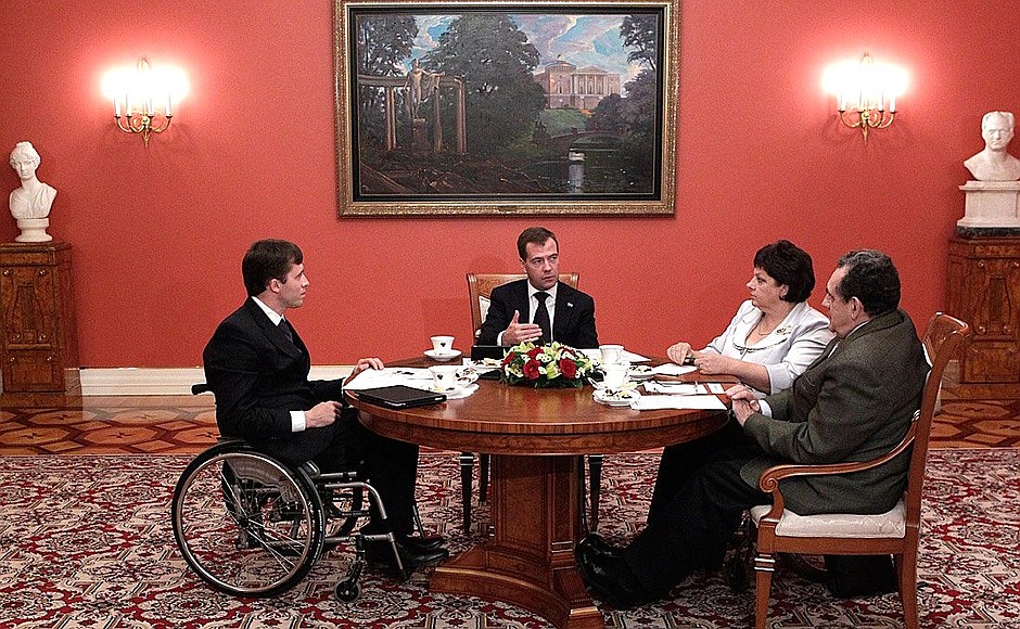 With representatives of public organisations for disabled persons: general secretary of the Russian Paralympic Committee Mikhail Terentiev (left), director of a sports and fitness club for people with disabilities Tatiana Karzubova and sociologist Dr Sergei Kavokin.