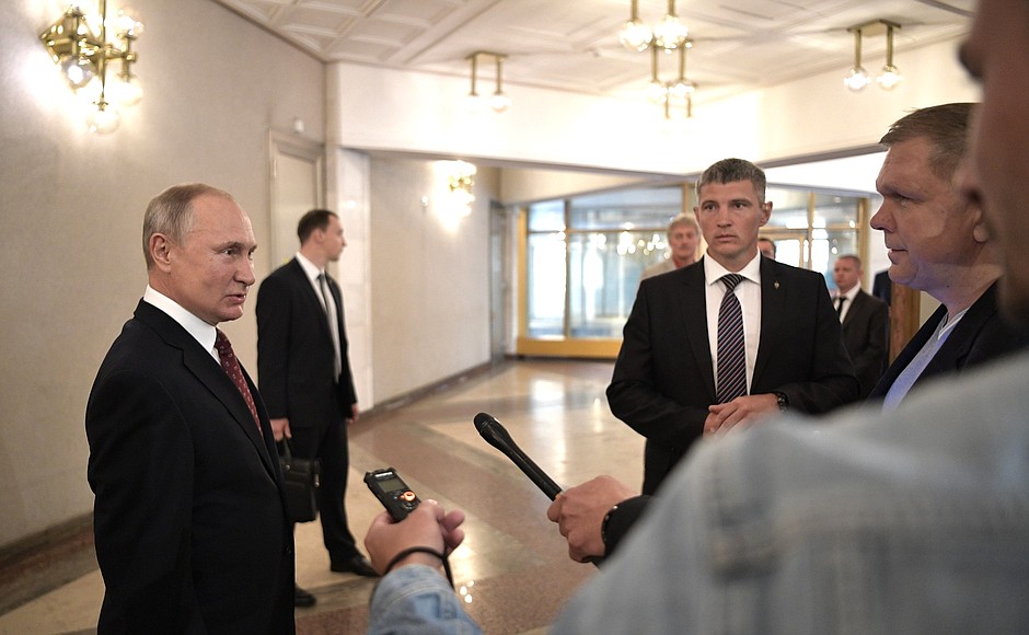 After he cast his ballot, Vladimir Putin answered questions from journalists.