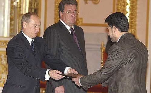 At a presentation ceremony of letters of credentials. On the left, Presidential aide Sergei Prikhod\'ko, on the very right, ambassador to the Republic of Iraq, Khashim Mustafa.
