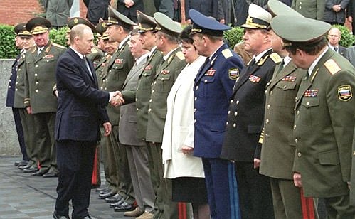 MOSCOW. Vladimir Putin with military commanders beside the rostrum in Red Square.