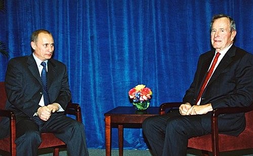 President Vladimir Putin meeting with George Bush Sr. at Rice University.