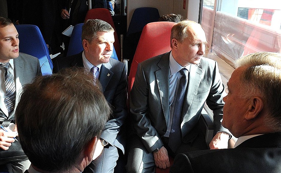 Mr Putin and Mr Bach arrived at the station on the new comfortable Lastochka train.
