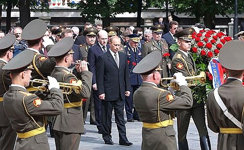 President Putin laying a wreath at the Tomb of the Unknown Soldier by the Kremlin Wall.