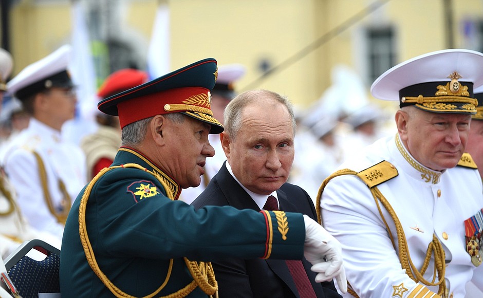 With Defense Minister Sergei Shoigu and Navy Commander-in-Chief Nikolai Yevmenov (right) during the Main Naval Parade.