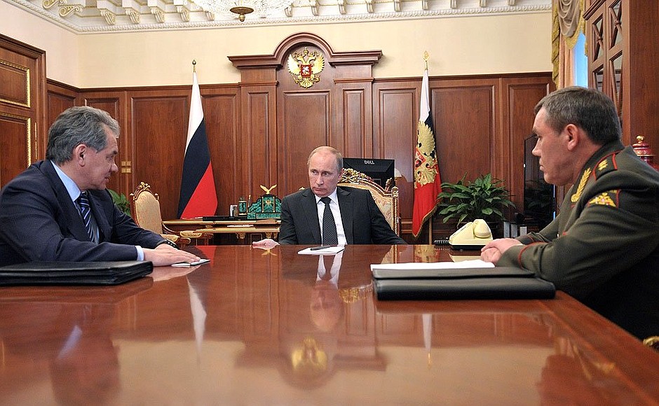 With Defence Minister Sergei Shoigu and Chief of the General Staff of the Russian Armed Forces Colonel General Valery Gerasimov.