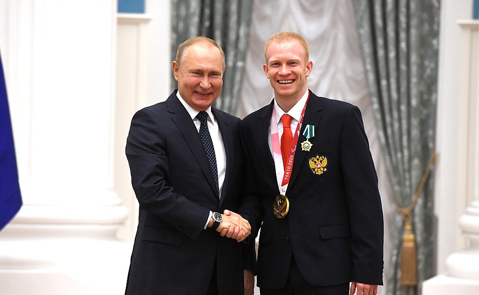 Presenting state decorations to winners of the 2020 Summer Paralympic Games in Tokyo. Dmitry Grigoryev, swimming champion of the Paralympics, receives the Order of Friendship.