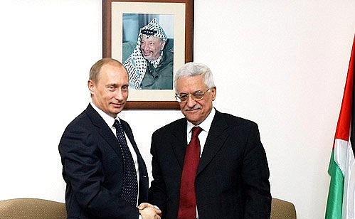 With the head of the Palestinian national authority, Mahmoud Abbas.