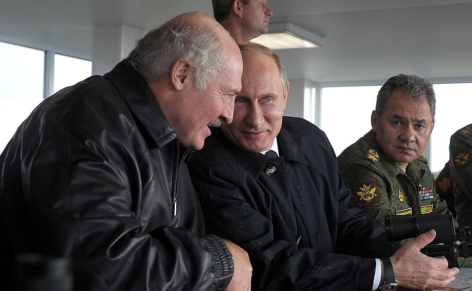 At the Khmelyovka test ground during the final stage of the Zapad-2013 Russian-Belarusian strategic military exercises. With Belarusian President Alexander Lukashenko and Defence Minister Sergei Shoigu.
