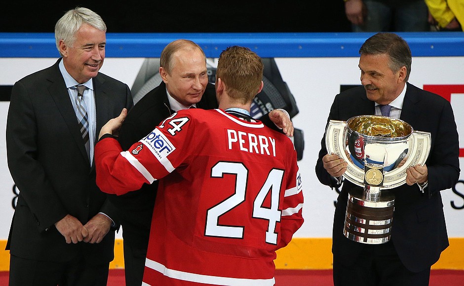 With Vice President of the International Ice Hockey Federation (IIHF) Bob Nicholson, IIHF President Rene Fasel and Canadian team captain Corey Perry during the 2016 IIHF World Championship awards ceremony.