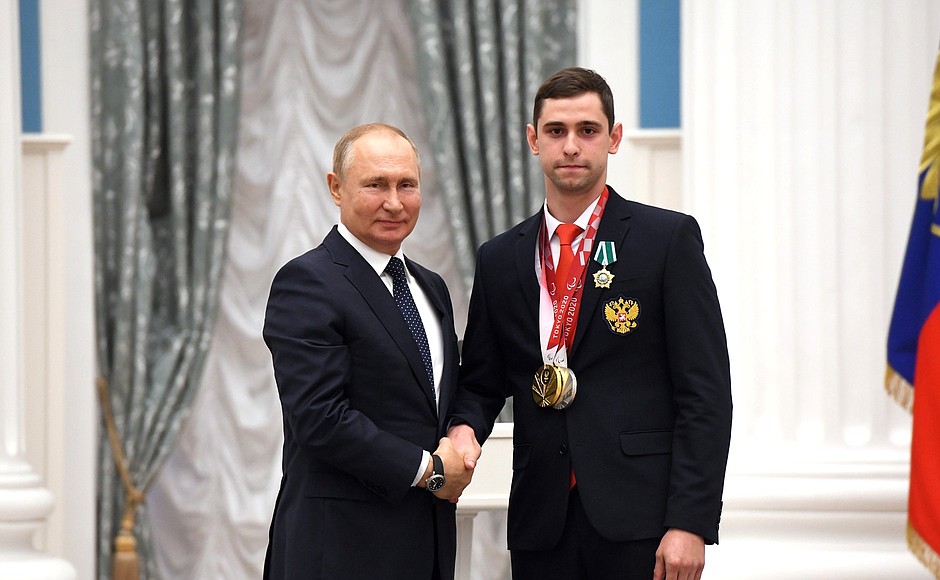 Presenting state decorations to winners of the 2020 Summer Paralympic Games in Tokyo. Maxim Shaburov, wheelchair fencing champion and silver medallist of the Paralympics, receives the Order of Friendship.