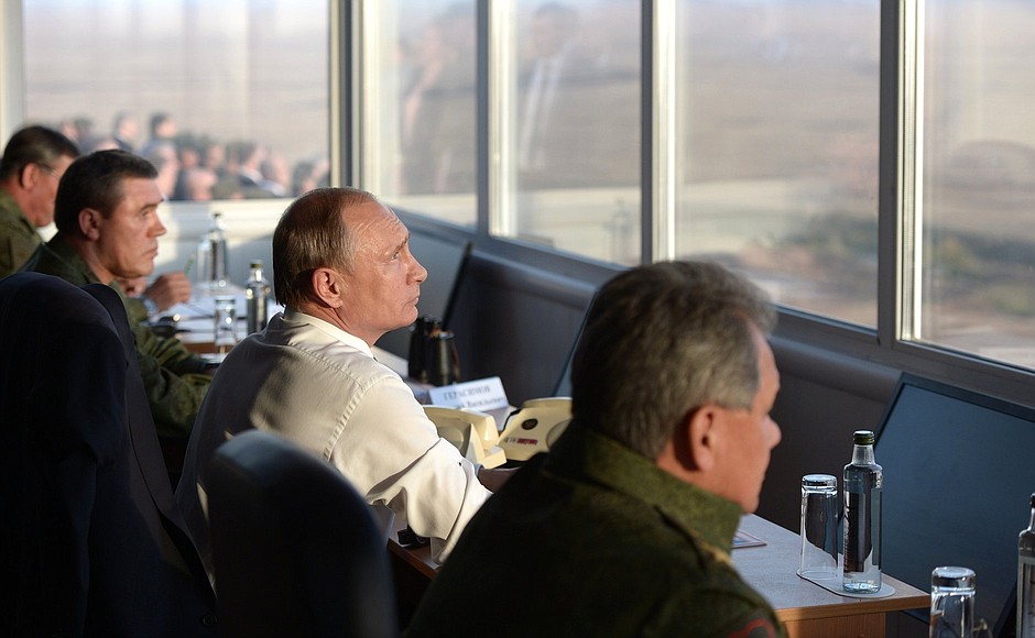 At the Donguzsky Test Ground during the final stage of the Tsentr-2015 strategic headquarters military exercises. With Defence Minister Sergei Shoigu (right) and Valery Gerasimov, Chief of the General Staff of the Armed Forces of the Russian Federation, first Deputy Minister of Defence of the Russian Federation.