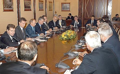 President Putin meeting with Russian and international business leaders.