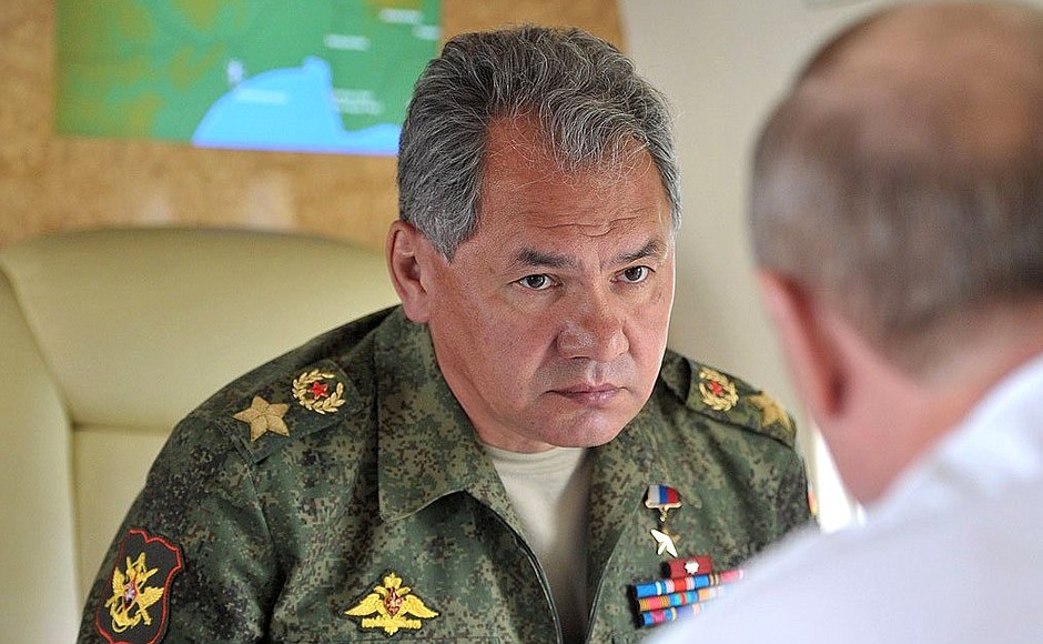 During the flight over the military exercises being held as part of the comprehensive troop inspection in the Eastern Military District. With Defence Minister Sergei Shoigu.