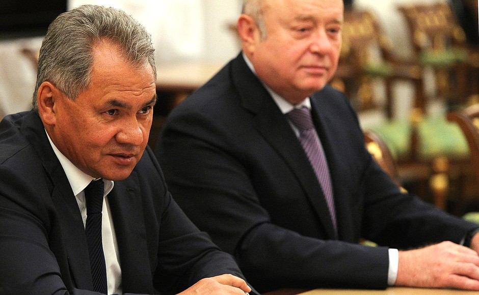 Defence Minister Sergei Shoigu and Director of the Foreign Intelligence Service Mikhail Fradkov at a meeting with permanent members of the Security Council.