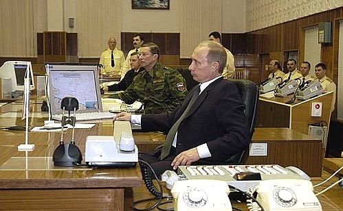 President Putin at the Northern Fleet command centre during a video link-up with the cruiser Varyag.