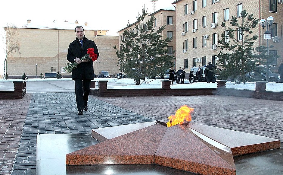Laying flowers at a memorial to Interior Ministry officers killed in the line of duty.