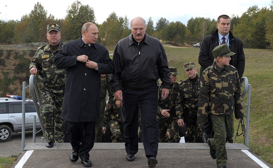 With Belarusian President Alexander Lukashenko at the Gozhsky test ground during the final stage of the Zapad-2013 Russian-Belarusian strategic military exercises.