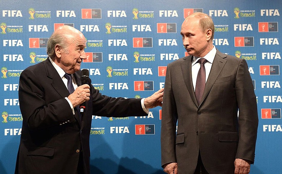 With FIFA President Joseph Blatter at the ceremony handing over the FIFA World Cup host country rights from Brazil to Russia.