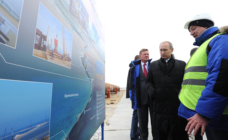 Looking over information stands about the Kerch Strait Bridge construction.