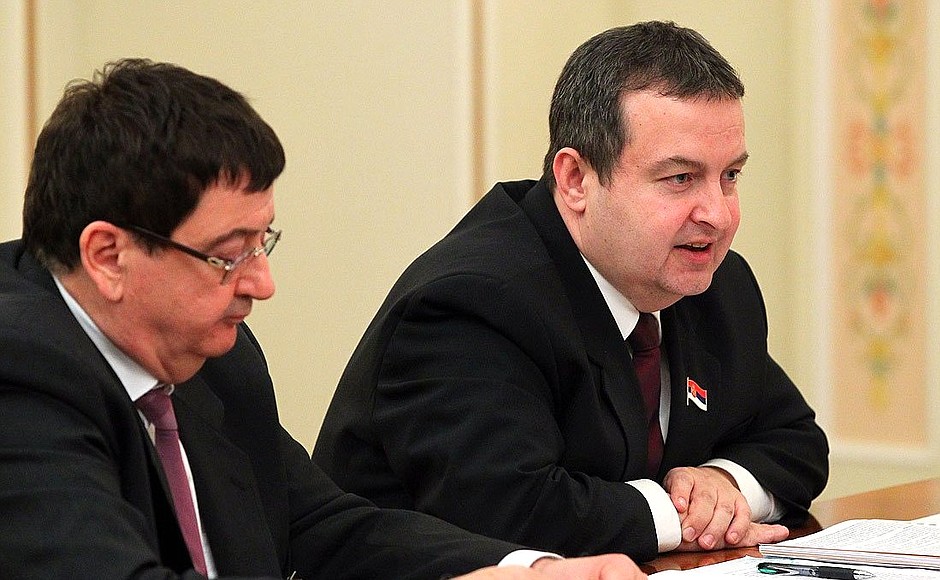 Serbian Prime Minister and Interior Minister Ivica Dacic (right).