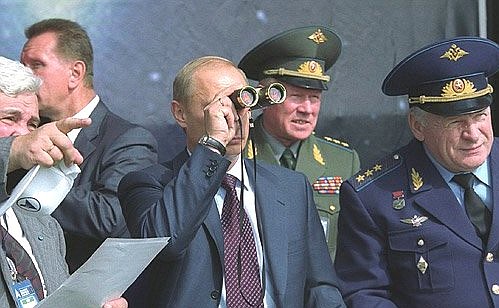 President Putin, Yury Koptev, General Director of the Russian Aerospace Agency (left), and Air Force Commander-in-Chief Vladimir Mikhailov watching demonstration flights at the sixth MAKS-2003 International Aerospace Show.