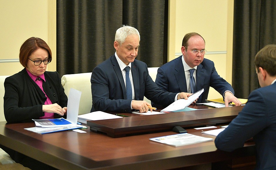 Before the meeting on economic issues. Chief of Staff of the Presidential Executive Office Anton Vaino, right, Presidential Aide Andrei Belousov and Central Bank Governor Elvira Nabiullina.