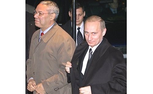 C. President Vladimir Putin with US Secretary of State Colin Powell near the Blair House official state guesthouse.