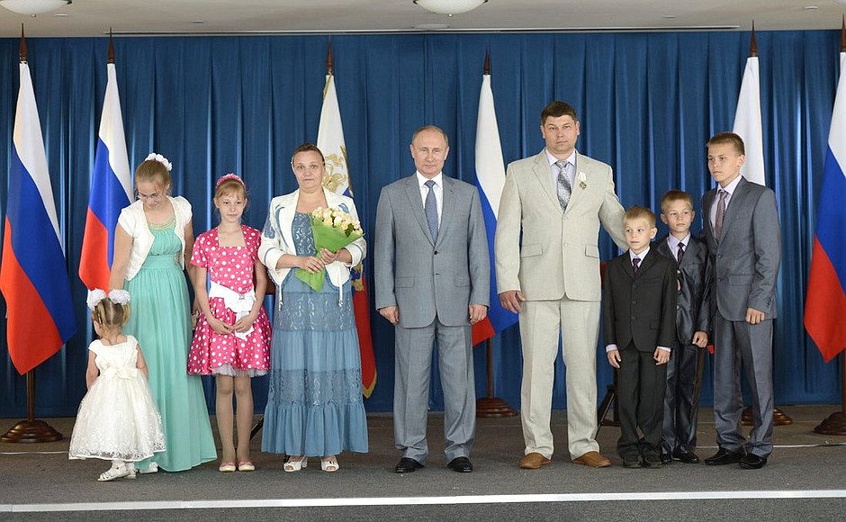 With one of the large families decorated with the Order of Parental Glory.