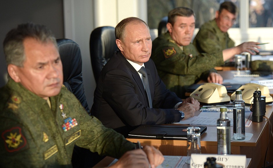 At the Donguzsky Test Ground during the final stage of the Tsentr-2015 strategic headquarters military exercises. With Defence Minister Sergei Shoigu (left) and Valery Gerasimov, Chief of the General Staff of the Armed Forces of the Russian Federation, first Deputy Minister of Defence of the Russian Federation.