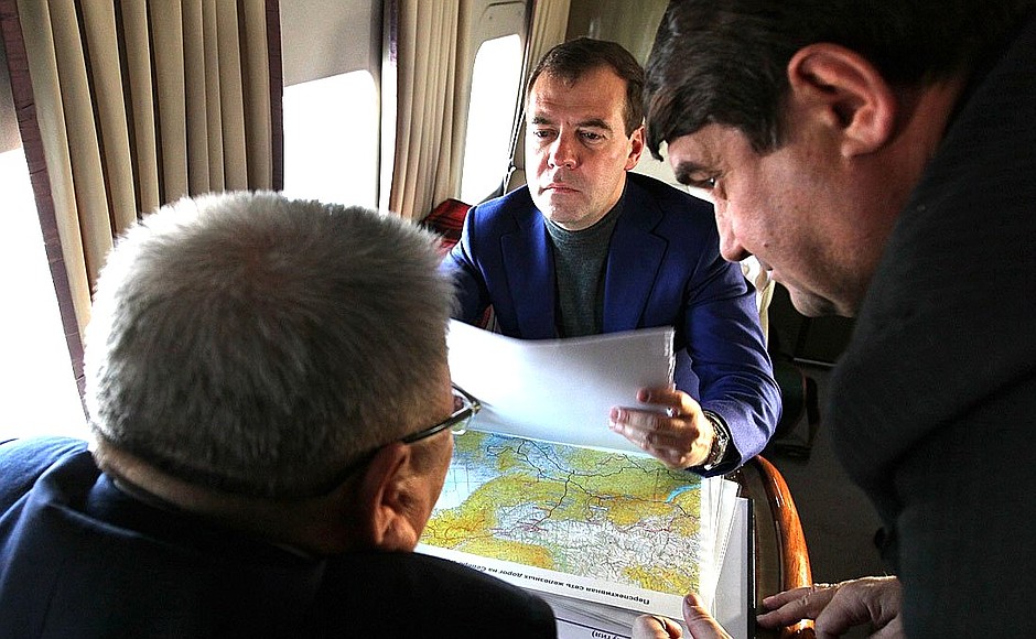 With Transport Minister Igor Levitin (right) and Head of the Republic of Sakha (Yakutia) Yegor Borisov during the flight to Yakutsk after the opening ceremony for the Berkakit-Tommot-Nizhny Bestyakh railway line.
