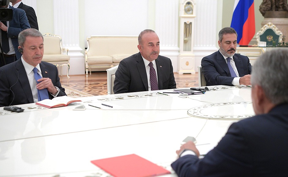 Vladimir Putin received Turkish Foreign Minister Mevlüt Çavuşoğlu and Turkish Minister of Defence Hulusi Akar (left) in the Kremlin. The meeting was also attended by Head of Turkey's National Intelligence Organisation Hakan Fidan (right).