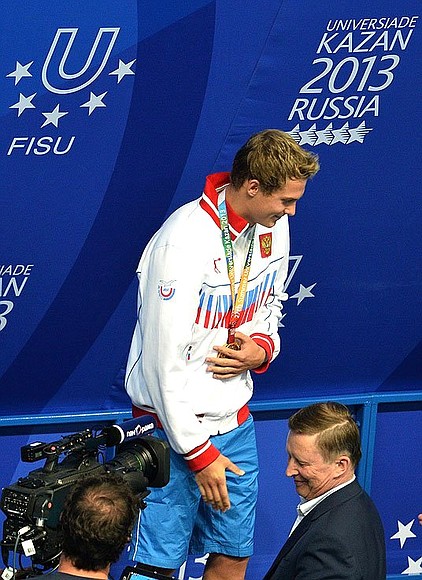 Sergei Ivanov presented medals to the three place winners in the 100 metres freestyle swimming event. Gold in the event went to Russia’s Vladimir Morozov.