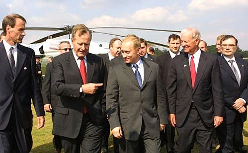 President Vladimir Putin meeting with George Bush Sr. near Rice University.