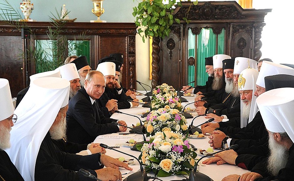 At a meeting with members of the Holy Synod and representatives of local Orthodox Churches.