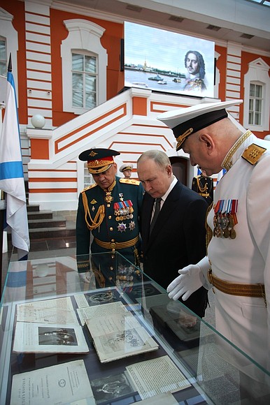With Defence Minister Sergei Shoigu (left) and Commander-in-Chief of the Russian Navy Nikolai Yevmenov at the St Petersburg State History Museum in the Peter and Paul Fortress.