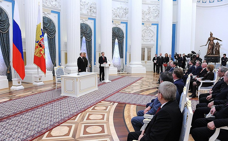 At ceremony signing the laws on admitting Crimea and Sevastopol to the Russian Federation.