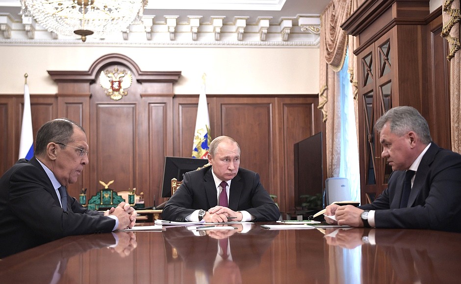 With Foreign Minister Sergei Lavrov (left) and Defence Minister Sergei Shoigu.