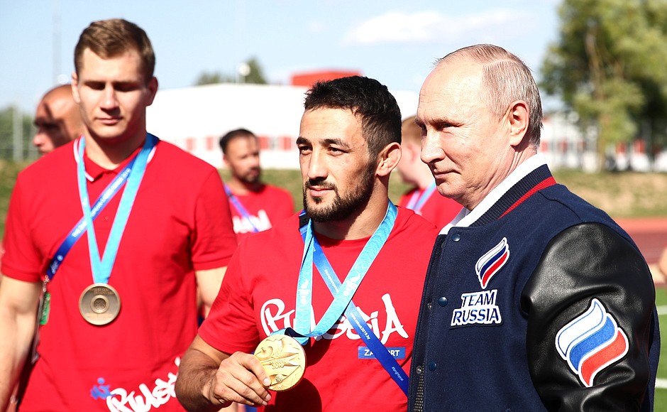 With Zaur Kabaloyev (centre), winner of the Greco-Roman wrestling event in the 67kg weigh class at the 2nd European Games.