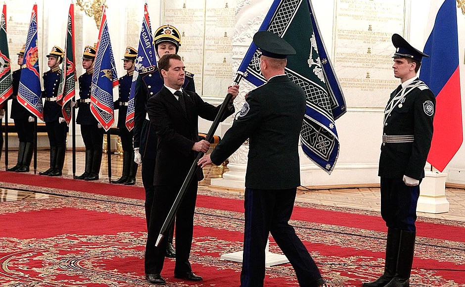 Presenting banners to Cossack military societies. Dmitry Medvedev presents the banner of Orenburg Cossack military society to ataman Vladimir Romanov.