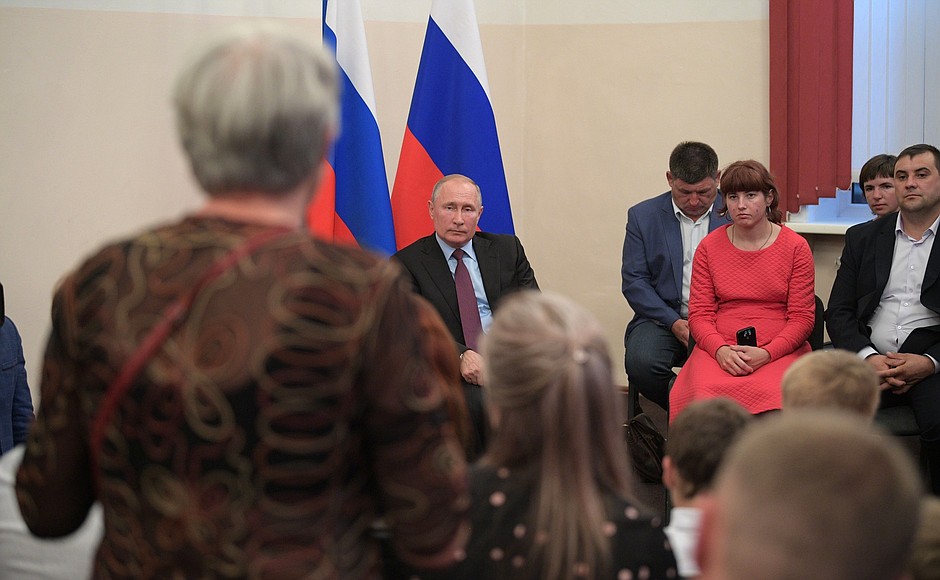 At a meeting with residents of the Irkutsk Region who took part in relief efforts following flash floods in the region, as well as with flood victims.