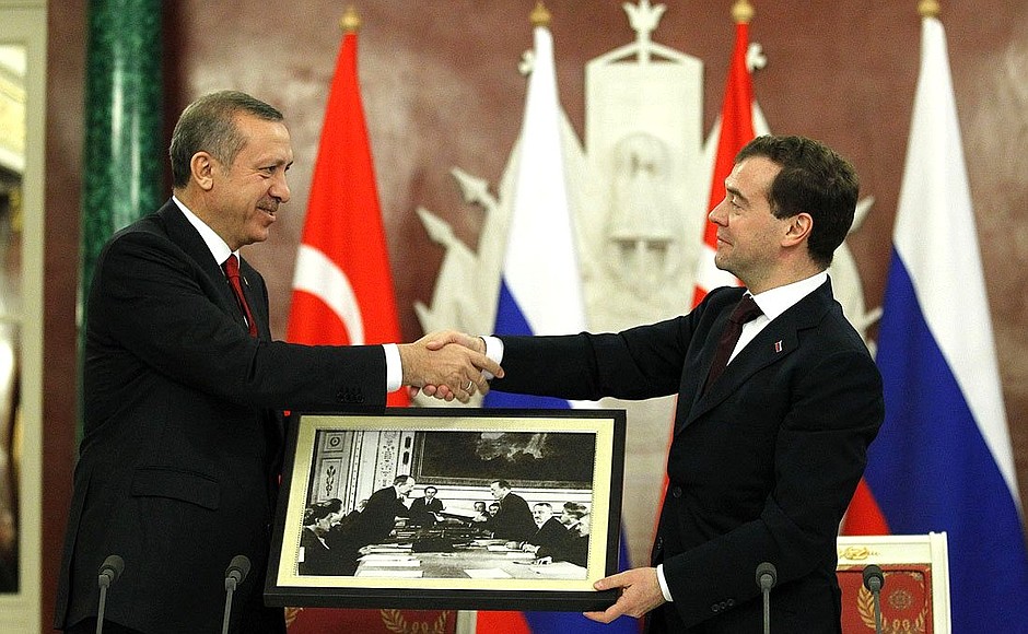 With Prime Minister of Turkey Recep Tayyip Erdogan after the joint news conference following meeting of High-Level Russian-Turkish Cooperation Council. Dmitry Medvedev presented Recep Tayyip Erdogan a photograph taken on March 16, 1921 in Moscow and depicting People's Commissar for Foreign Affairs of Russia and the USSR Georgy Chicherin and representative of the Grand National Assembly of Turkey Yusuf Kemal Bey exchange copies of the Treaty of Friendship and Brotherhood between Turkey and Russia.