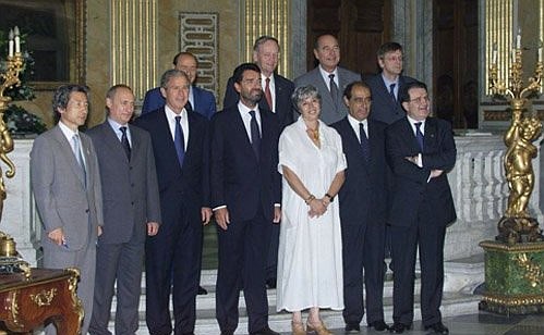 Delegates to the G8 summit making entries in the distinguished visitors\' “Golden Book” at a ceremony in Genoa.