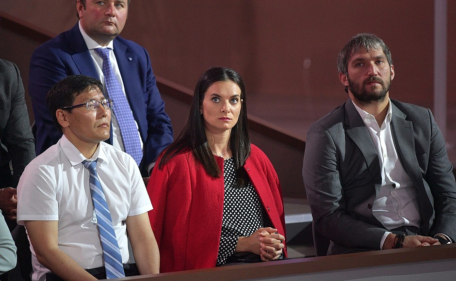 Elena Isinbayeva, International Olympic Committee member, and Alexander Ovechkin, right, Russian national ice hockey team forward, during Direct Line with Vladimir Putin.