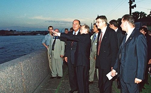 President Vladimir Putin and French President Jacques Chirac taking a walk on the bank of the Neva River.