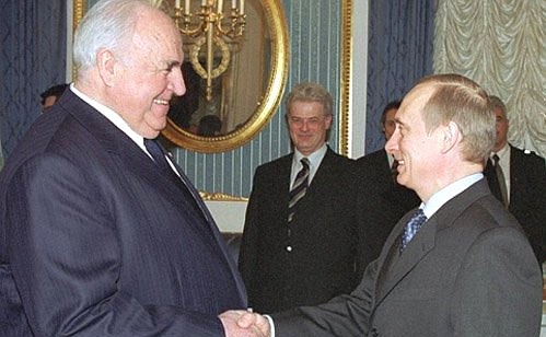 President Vladimir Putin meeting with former German Chancellor Helmut Kohl.