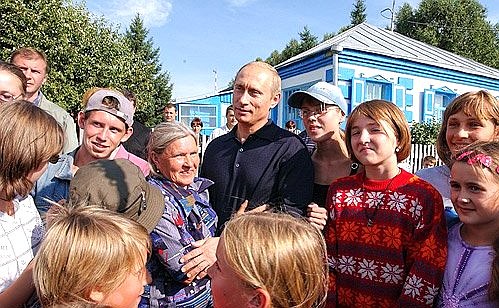 President Putin with residents of the Srostki village.